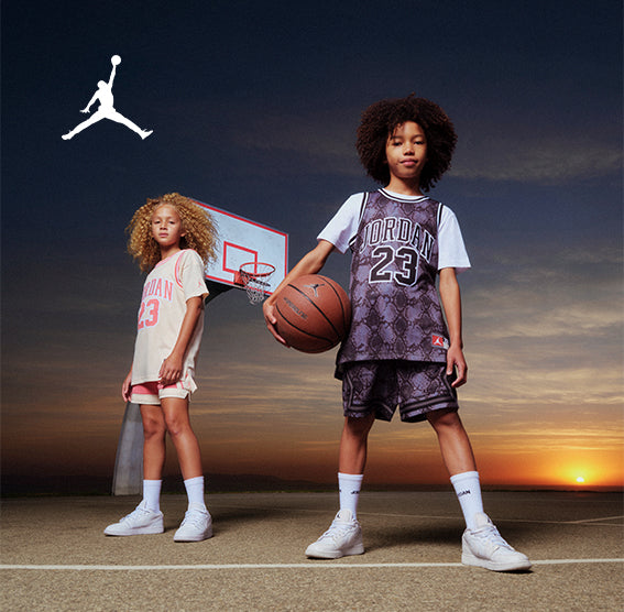 Girl wearing Jordan 23 Big Kid Girls' Jersey - pink, Boy wearing Jordan 23 Printed Big Kid Girls'/Boys' Jersey - black